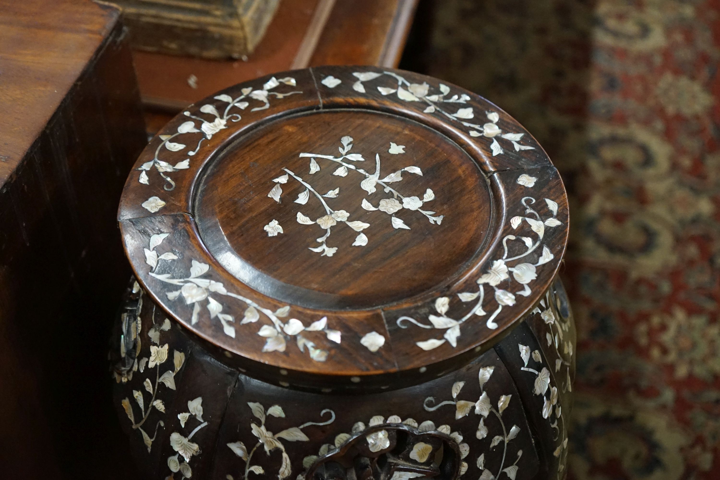 A pair of Chinese mother of pearl inset hardwood vase stands, height 92cm